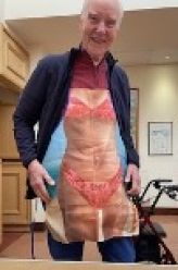 Gentleman wearing humourous apron Gentleman wearing humourous apron